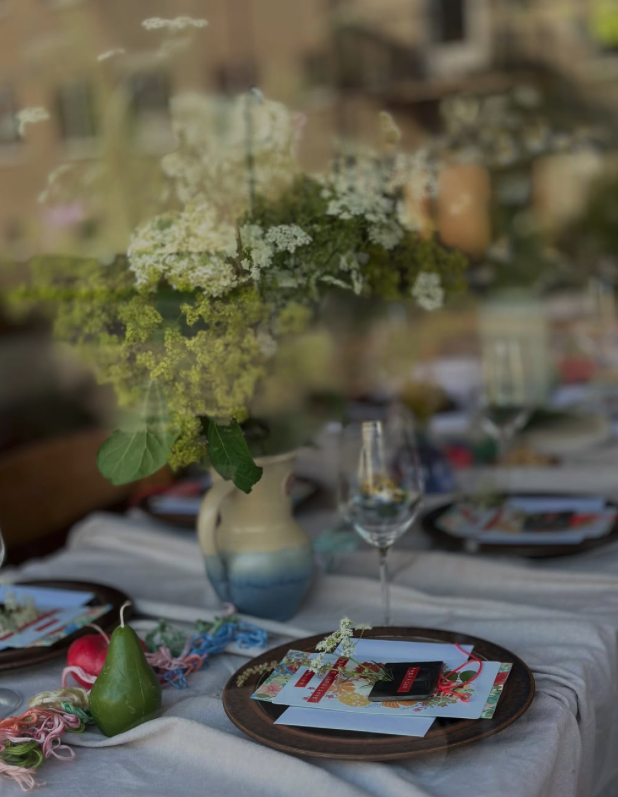 Long table set with flowers for a community dinner